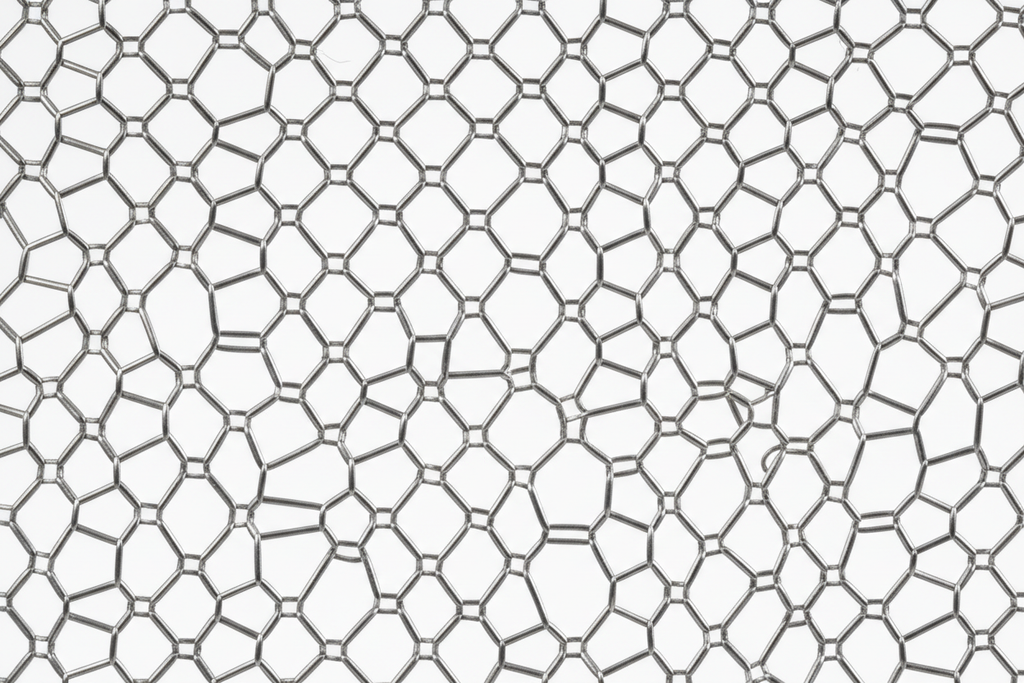 Magnified macro photograph of ANGIOGUARD RX emboli filter mesh showing 100-micron pore geometry and nitinol basket architecture